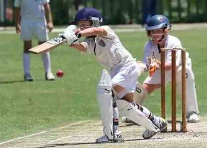 Children playing a Cricket Match