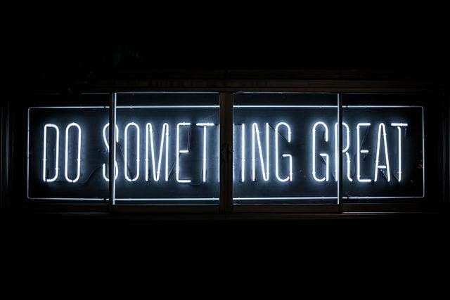 a "do something great" neon sign - Career Myths and Misconceptions