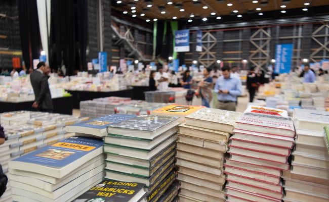 People are purchasing books in a book fair